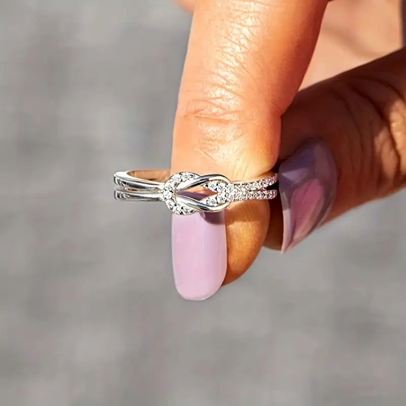 Elegant Twist Sterling Silver Infinity Ring